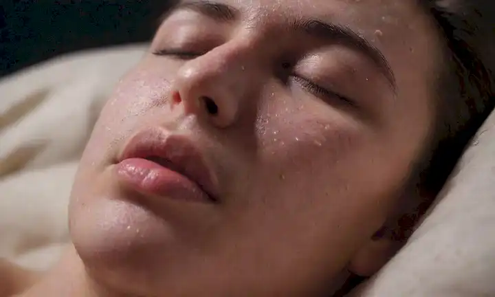 ilustración 3D de una persona dormida rodeada de gotas de saliva