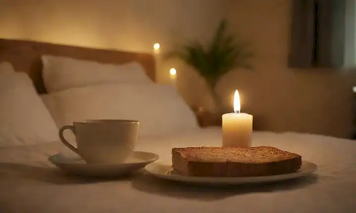 Una cálida iluminación dorada, un ambiente reconfortante, una persona que se relaja en su cama o sofá, con un plato de comida delante de ellos, rodeado de elementos calmantes como velas o plantas, tal vez un libro o una taza de té cerca